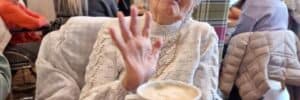 Nursing home patient at Olea Care Group having coffee